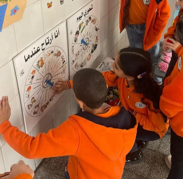 A child writes on the board